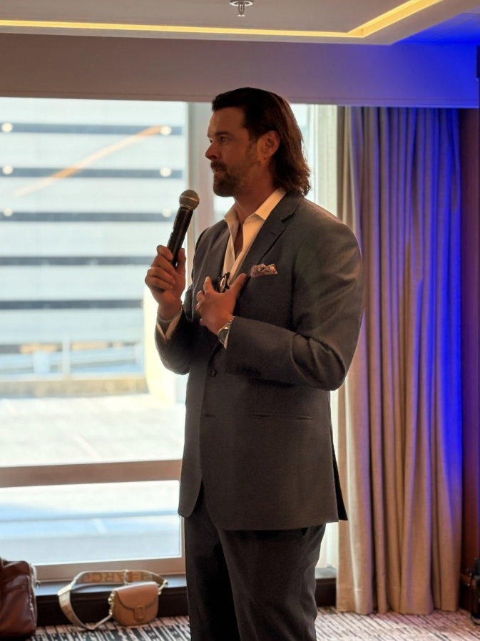JP Warren speaking on stage